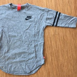 Nike grey 3/4 length sleeved shirt.